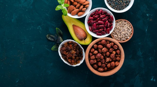 Superfoods Healthy food. Nuts, berries, fruits, and legumes. On